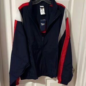 NWT. Reebok Windbreaker Blue Red Lightweight Jacket